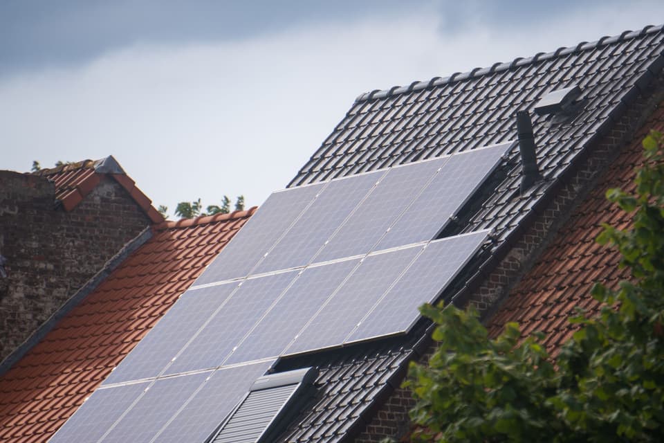 A roof with solar panels on it