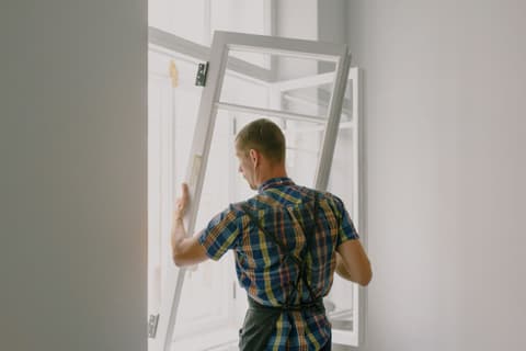 Unrecognizable workman installing window in house during renovation process — Ksenia Chernaya, Pexels License